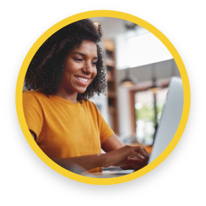 Woman smiles while working on computer