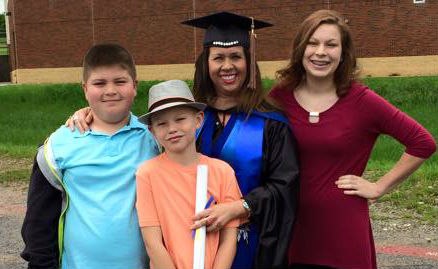 Julia Boyd with family at graduation